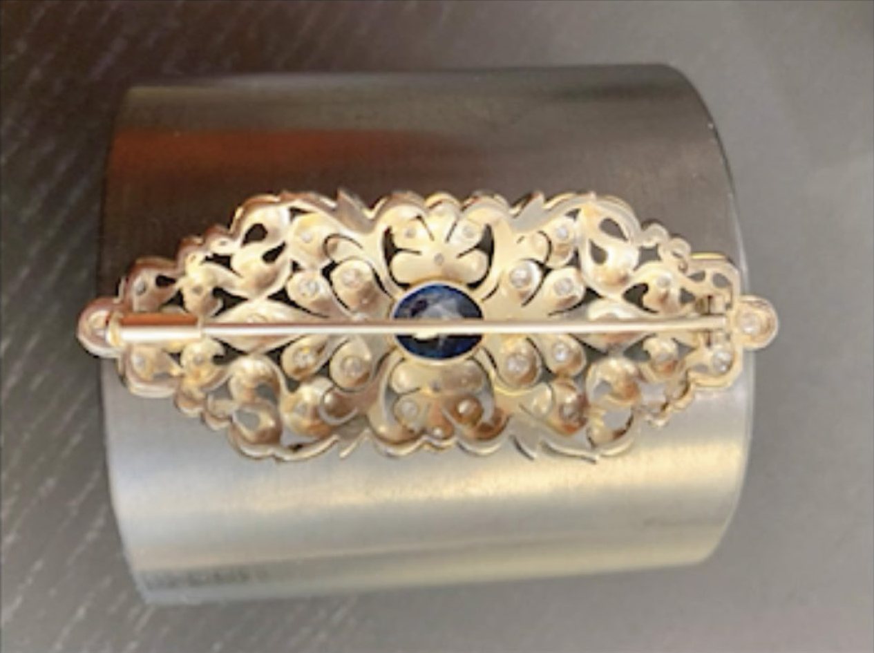 The sapphire brooch seen from the back, with its pin