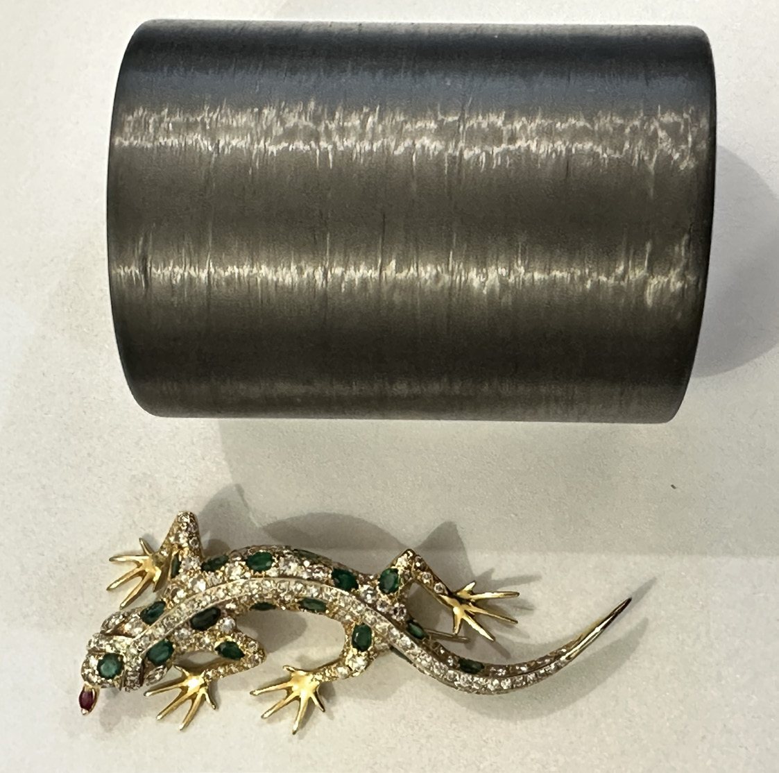 Before: the salamander brooch next to the rigid cuff